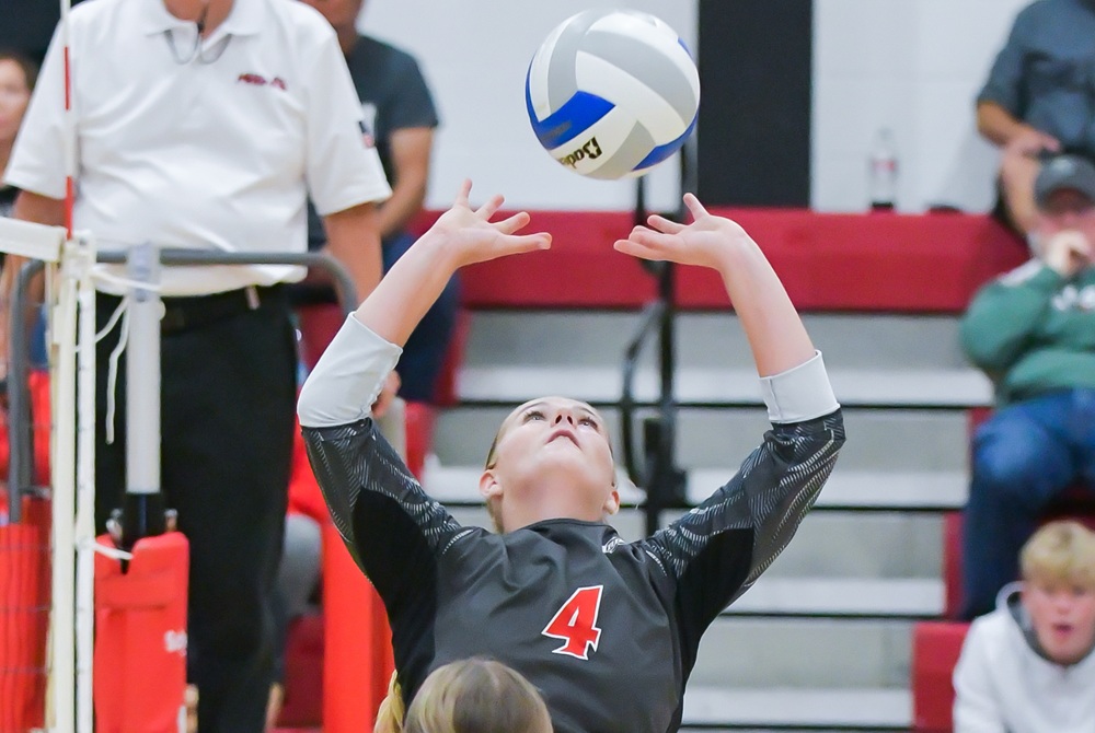 A Mount Pleasant Sacred Heart setter passes to a teammate during the Irish's match against Carson City-Crystal earlier this month.