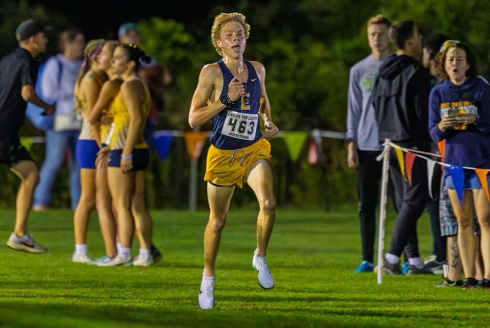 East Grand Rapids’ Jonah Workman runs at Grand Rapids South Christian’s Under the Lights Invite on Aug. 22.