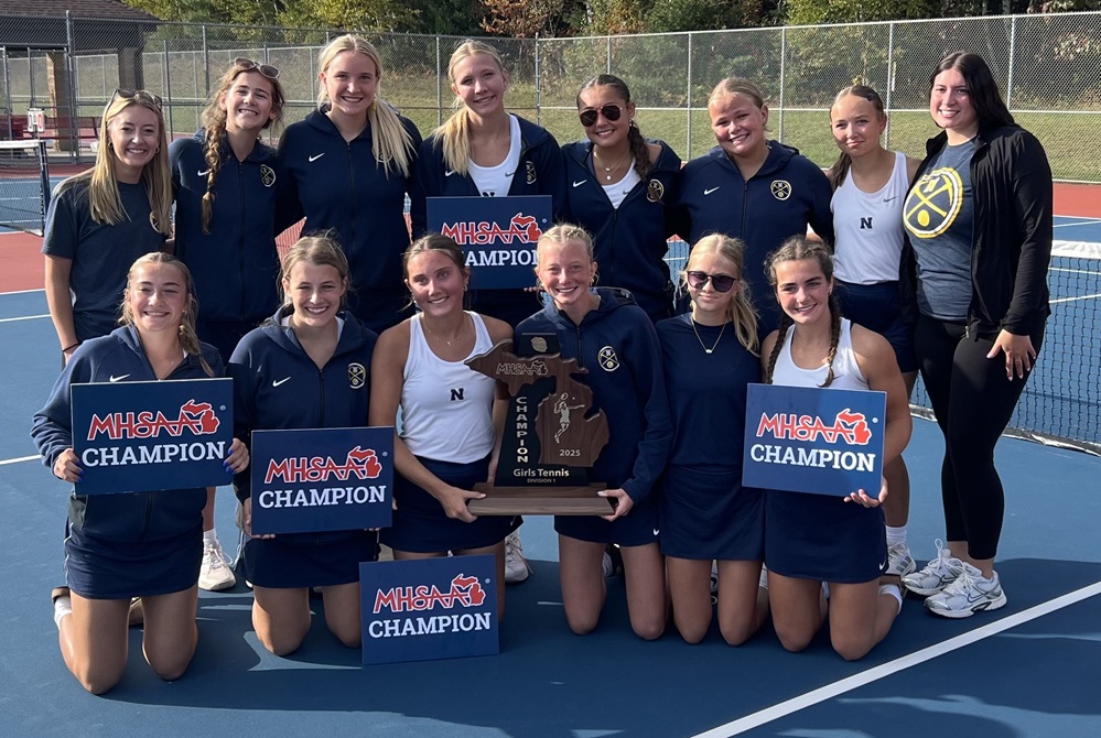 The Negaunee girls tennis team poses with its championship trophy.