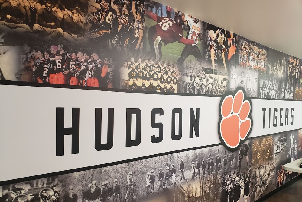 A wall in the Hudson press box tells of the football program’s rich history. 