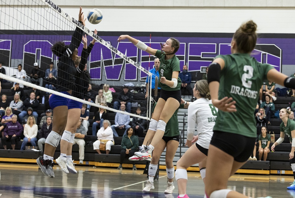 Lake Orion’s Lilah Eliassen (9) powers a kill attempt toward a block by Bloomfield Hills on Saturday. 