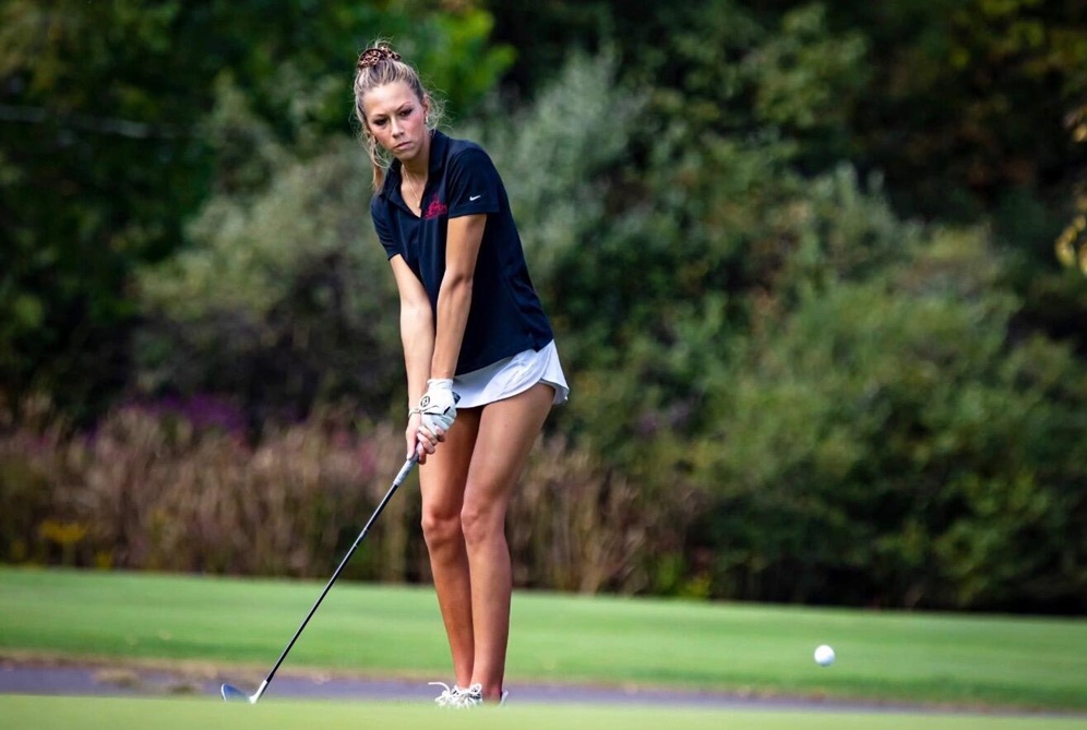 Avery Manning chips a shot toward the green.