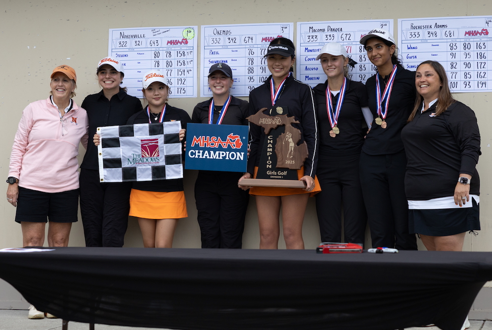 Northville takes a photo with its latest championship trophy.