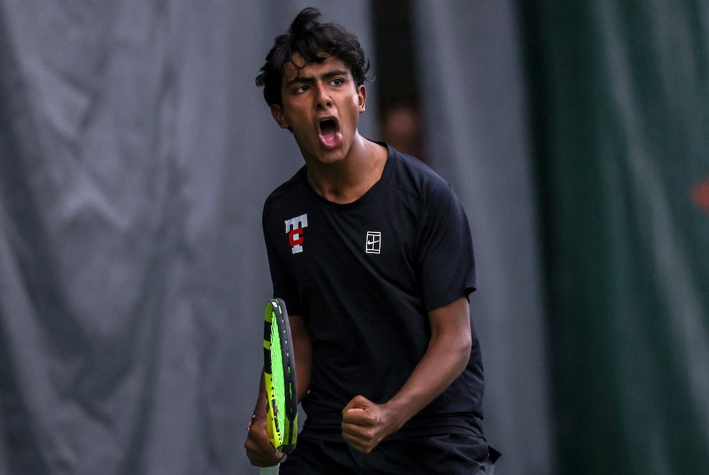 A Troy tennis player celebrates during the Lower Peninsula Division 1 Finals.