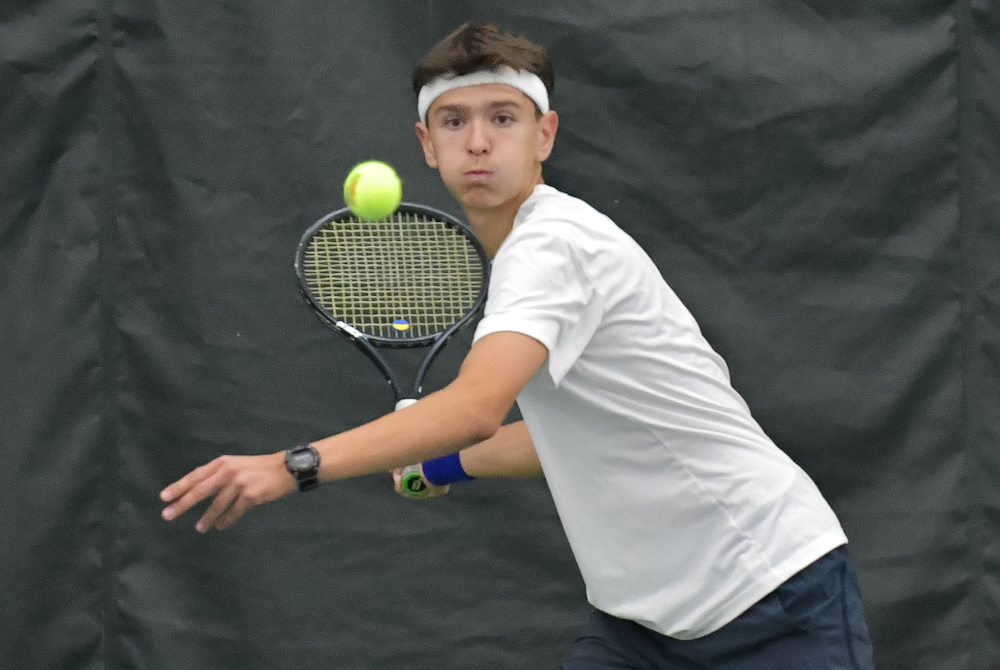A Grosse Pointe Woods University Liggett tennis players winds up for a forehand.