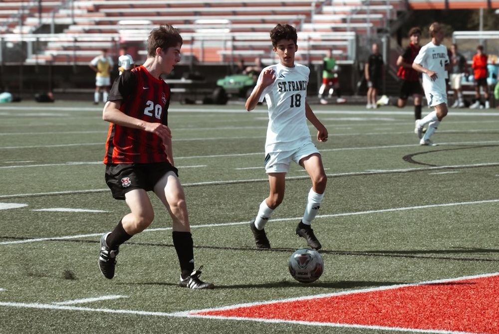 Cedar Springs’ Marcus McCarthy (20) considers his options offensively during a September scrimmage against Traverse City St. Francis.