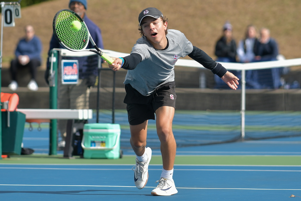 A Seaholm tennis player reaches for a forehand.