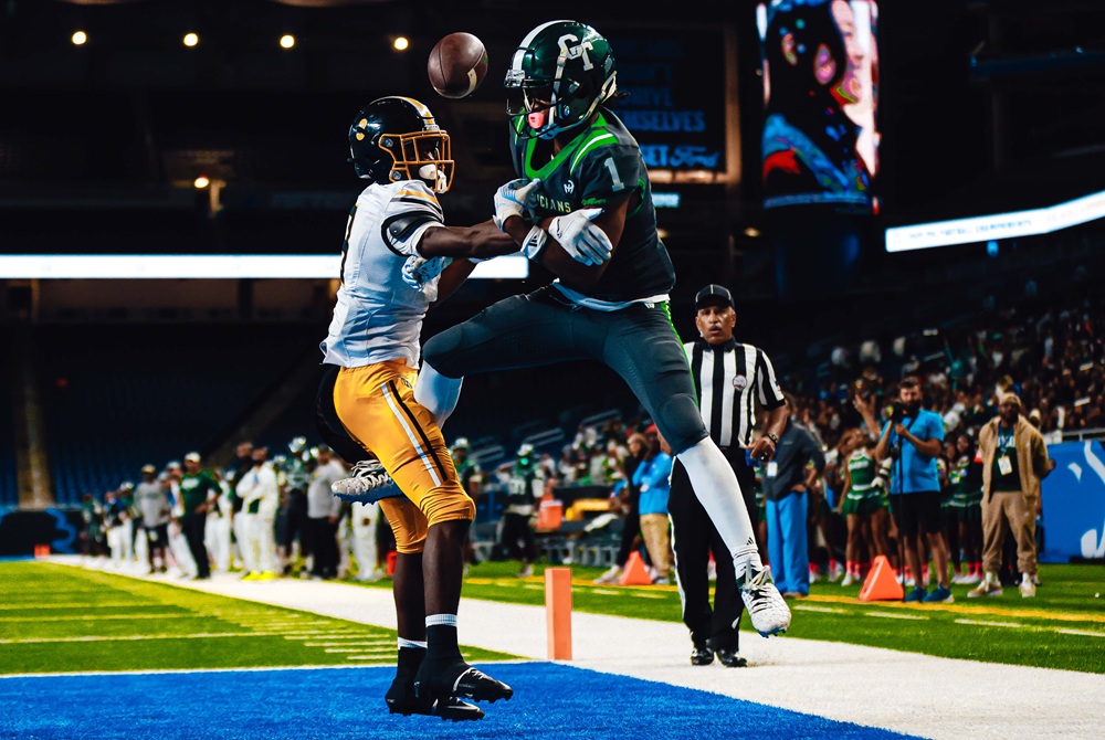Detroit Martin Luther King and Cass Tech players contend for a pass in the end zone during last week's PSL Blue city championship game.