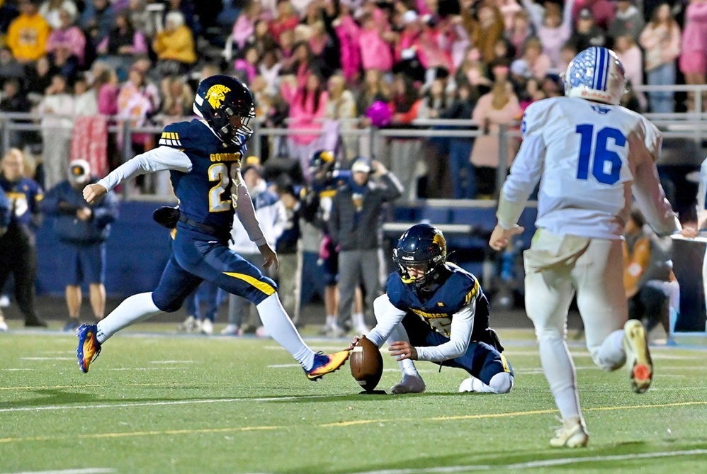 The Goodrich kicker prepares to connect with the ball. 