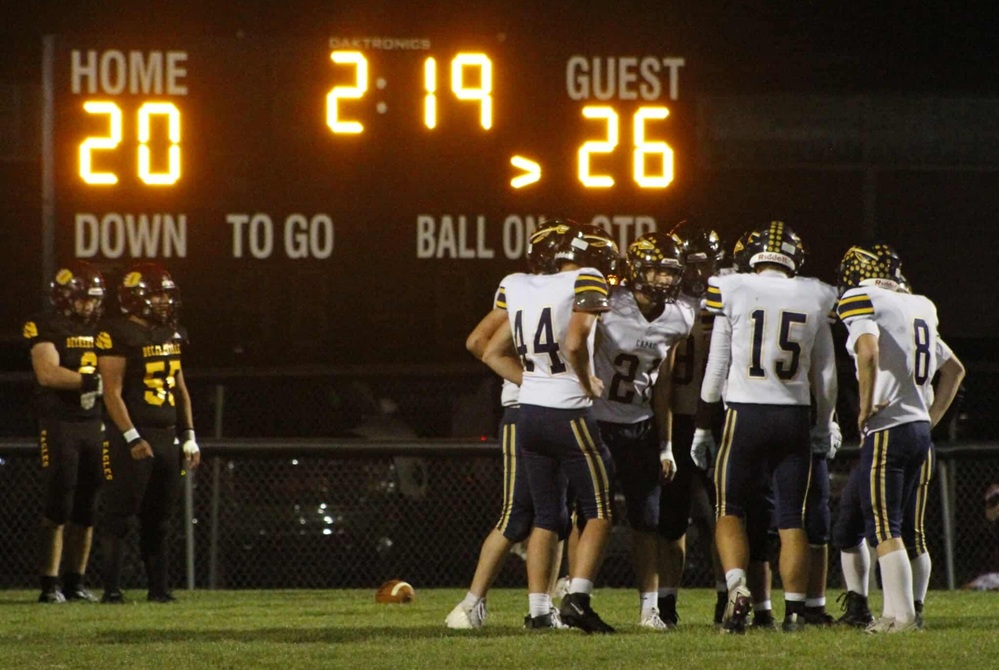 Capac huddles up during the closing minutes of its Week 8 win over Deckerville.