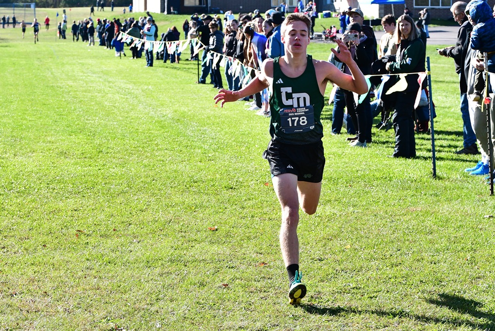 Central Montcalm’s Gage Hoffman crosses the finish line first Saturday at his Division 3 Regional at Bath. 