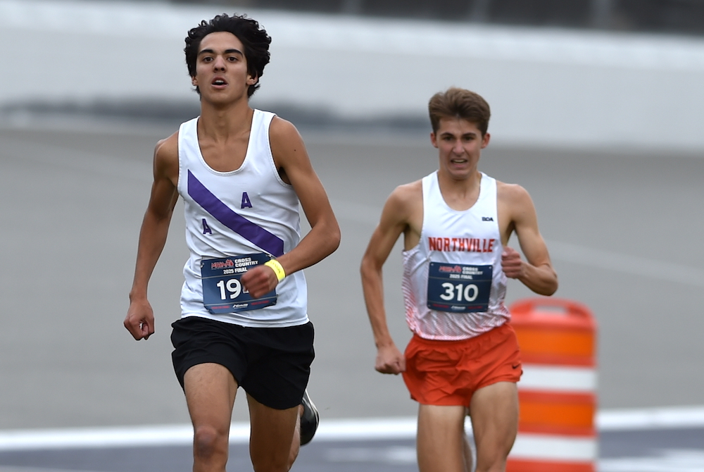 Ann Arbor Pioneer’s Kamari Ronfeldt pulls away from Northville’s Brandon Cloud at the front of Saturday’s Division 1 championship race. 