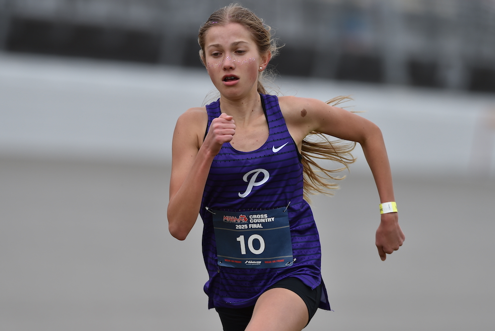 Ann Arbor Pioneer’s Natasza Dudek approaches the finish line Saturday as she completes the fastest race in MHSAA Finals history.