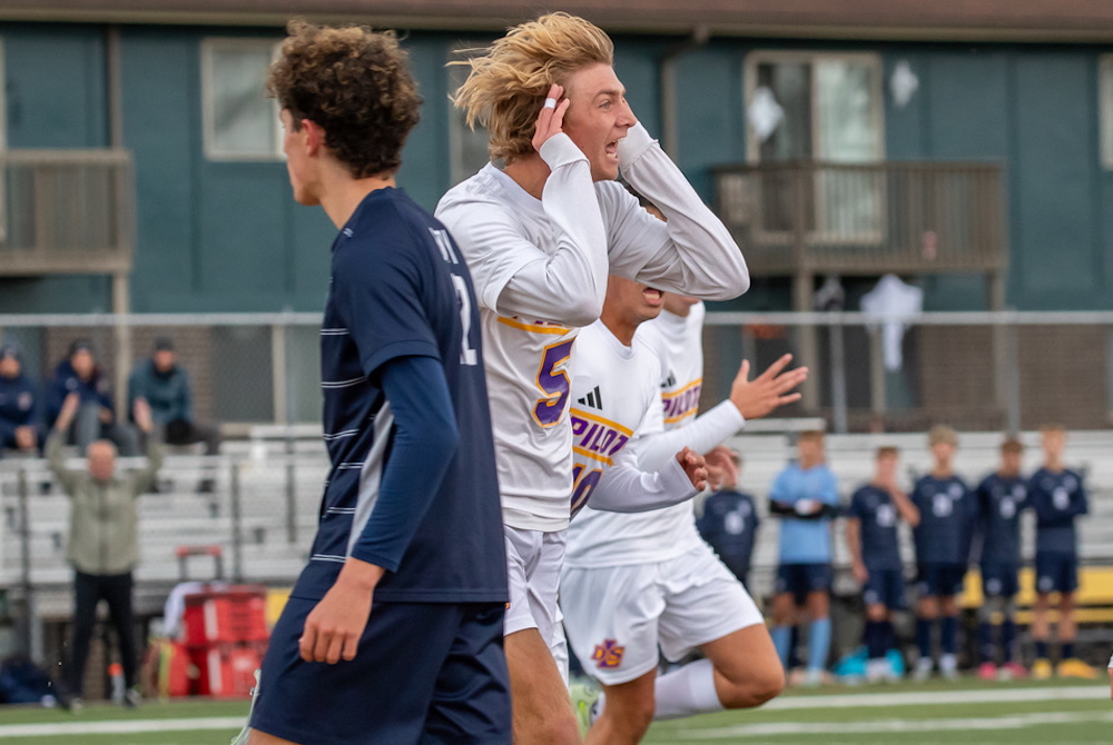 De La Salle’s James Spicuzzi (5) and his teammates celebrate during Saturday’s Division 2 Final. 