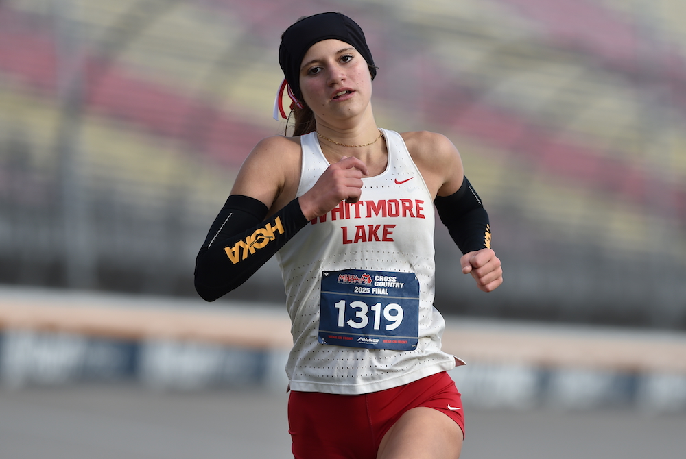 Whitmore Lake’s Kaylie Livingston charges toward the finish line on the way to repeating as Division 4 champion Saturday morning.