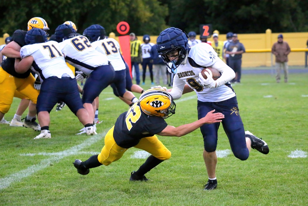 Gionni McDonough (9) breaks outside trying to elude the tackle of Ethan Davis (22) during Bark River-Harris' win over Iron Mountain on Oct. 10.