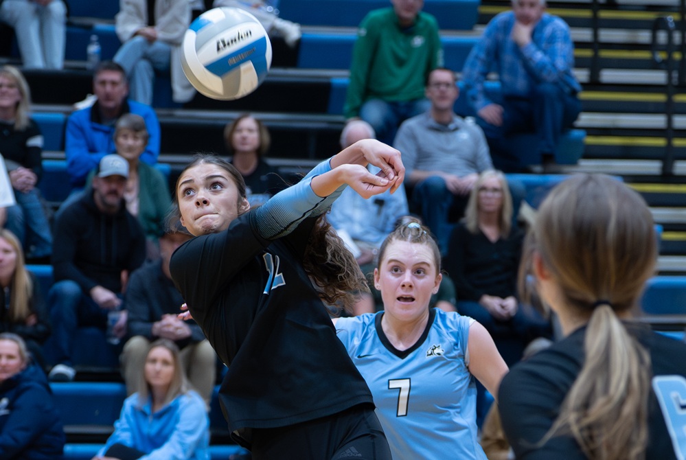 Grand Rapids Forest Hills Northern’s Isabel Ayars (12) gets to a ball during her team’s Division 1 District Final win over East Grand Rapids on Thursday.