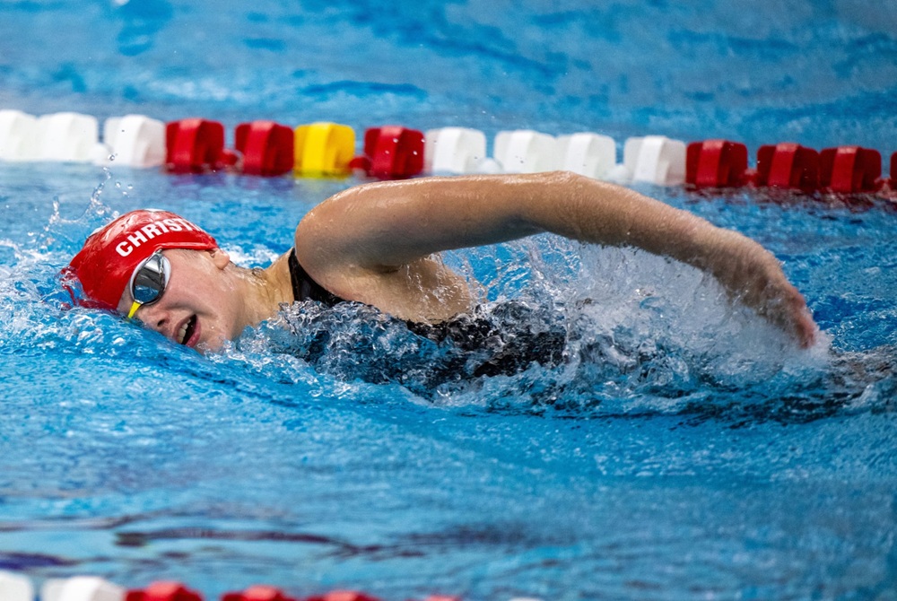 Grand Blanc’s Ava Christian swims a freestyle race this season. 