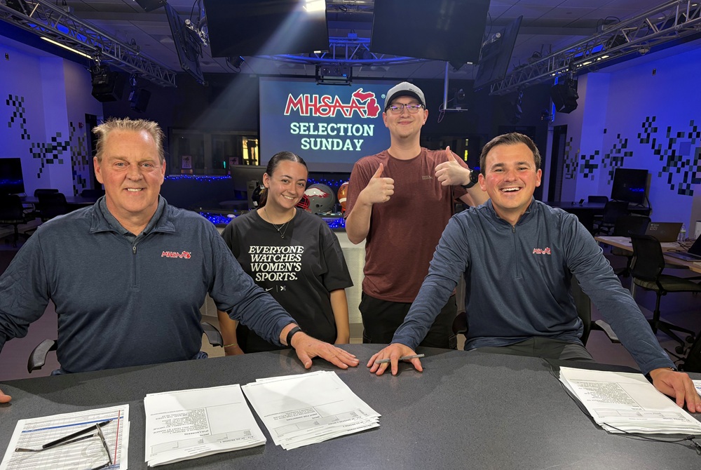 From left: Ben Holden, Madison McCarter, Ryan Riopelle, Evan Stockton crew the first Sunday Selection Show exclusively on the NFHS Network, from the Michigan State University School of Journalism Newsroom.