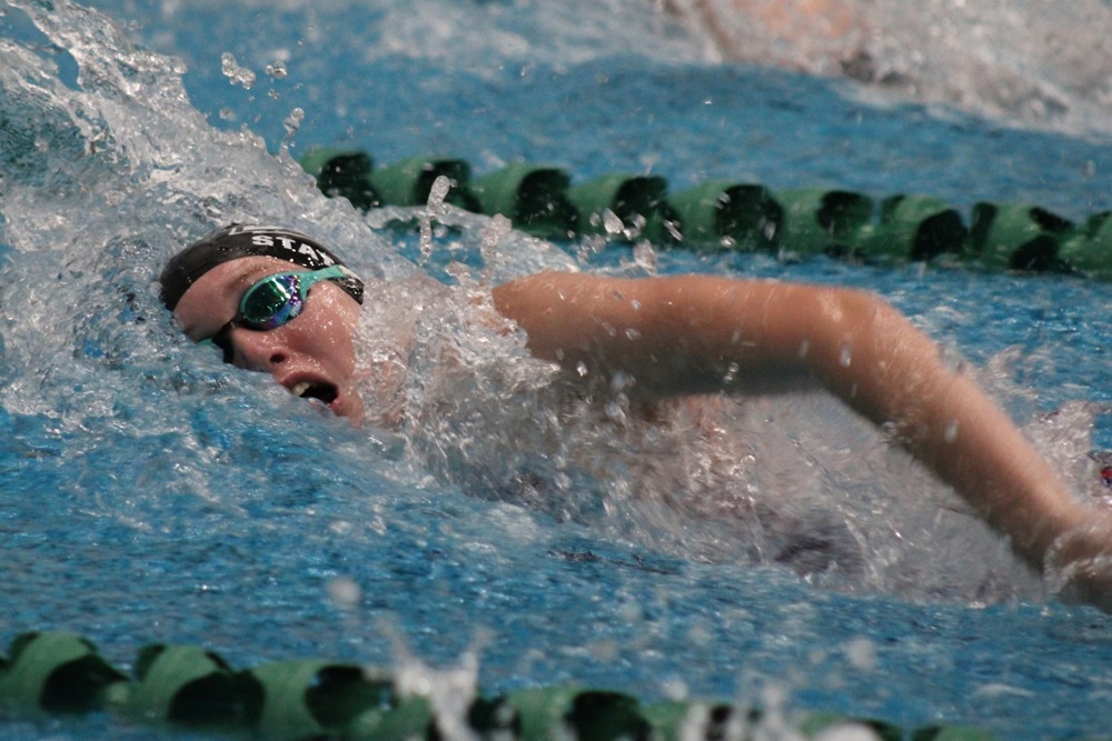 Ella Laupp swims a freestyle race.