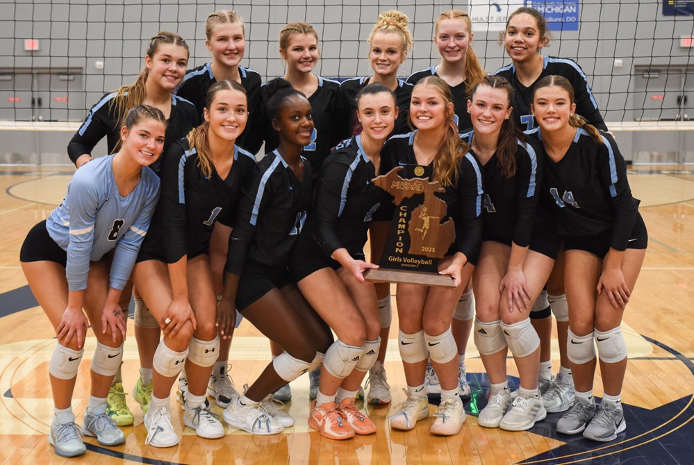 Grand Rapids Christian takes a photo with their newly-won Regional championship trophy last week. 