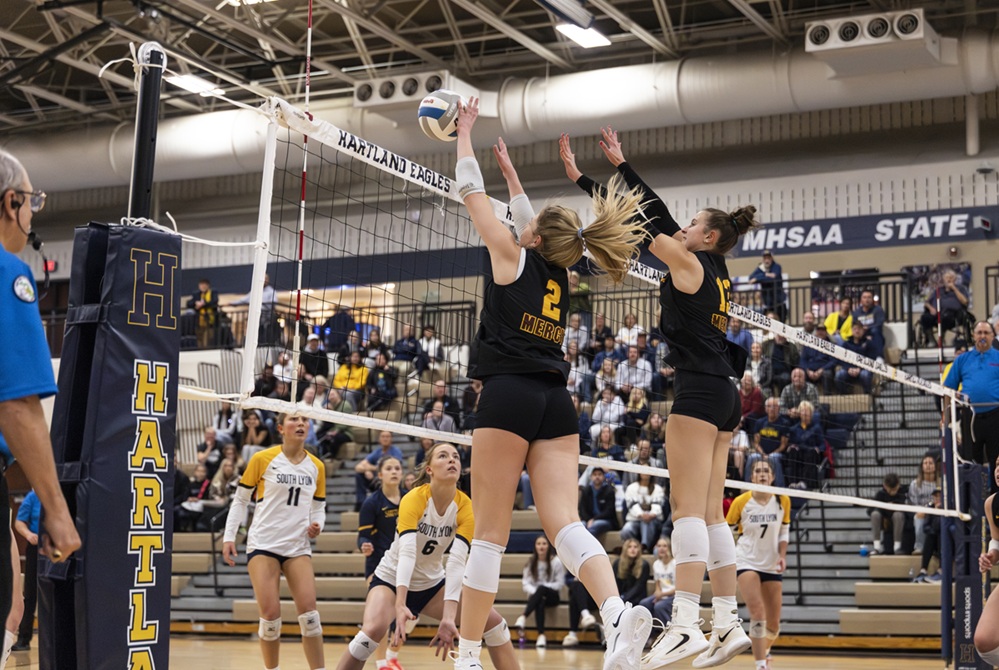 Farmington Hills Mercy's Kate Kalczynski (2) and Ella Andrews put up a block during a Regional Final win over South Lyon. 