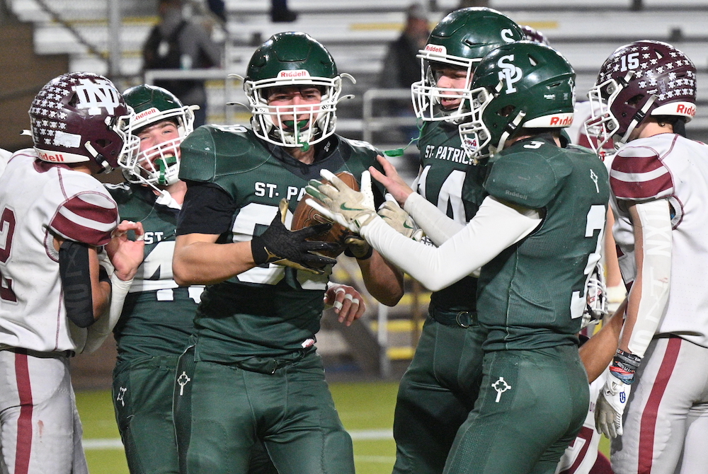 Portland St. Patrick players celebrate a touchdown Saturday at Superior Dome.