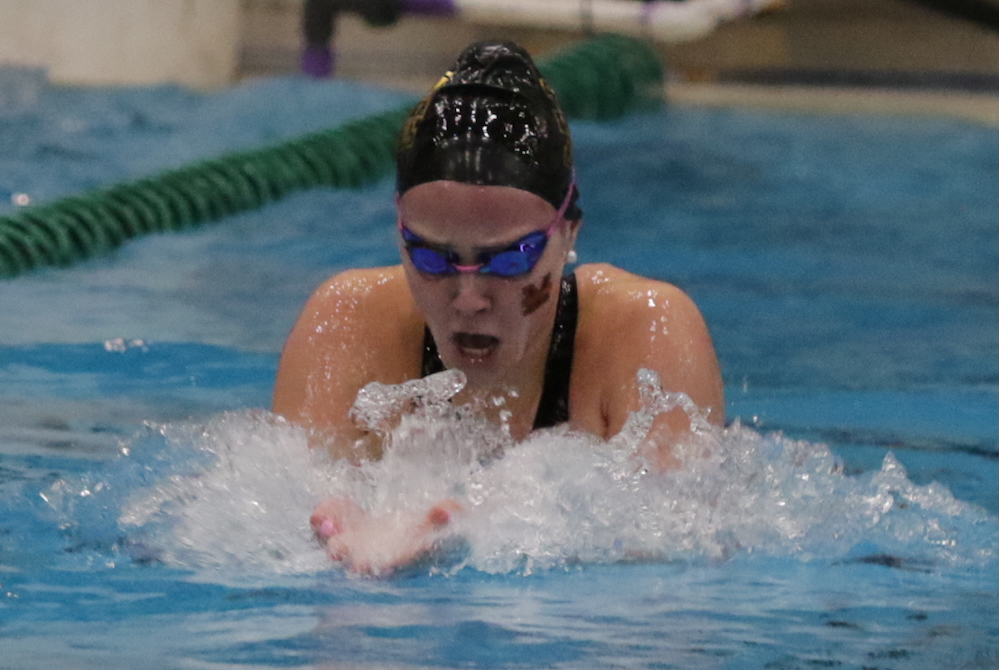 Farmington Hills Mercy’s Avery Tack swims to a championship in the 200 individual medley Saturday. 