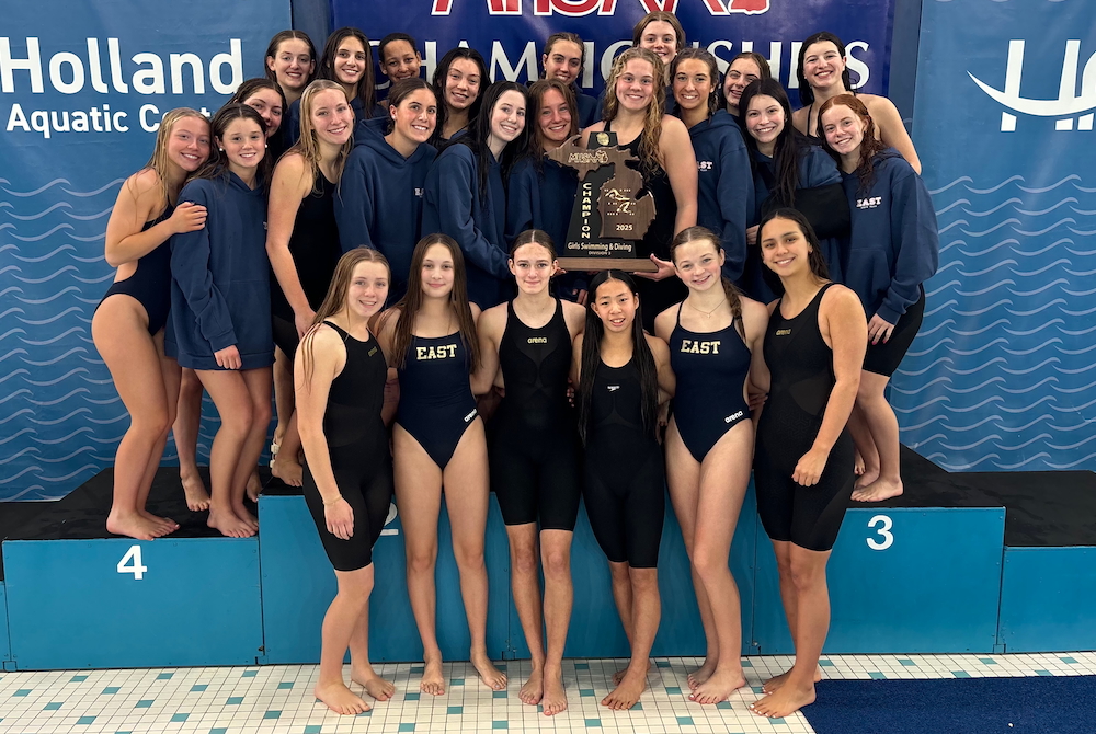 East Grand Rapids takes a team photo with its latest championship trophy.