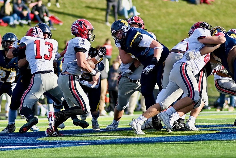 Dearborn Divine Child running back Marcello Vitti (2) takes a handoff into the line during his team's Division 4 Semifinal win over Goodrich.