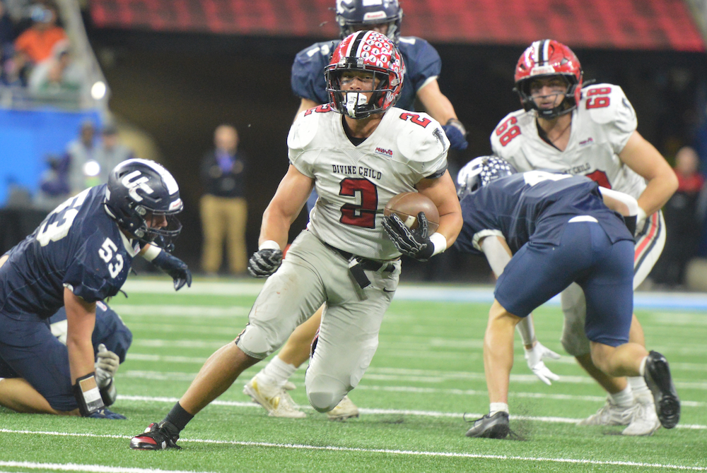 Dearborn Divine Child’s Marcello Vitti (2) breaks through the line during Friday’s Division 4 Final.