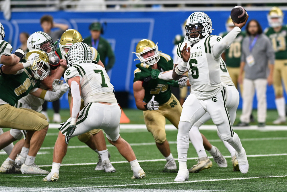 Grand Rapids West Catholic quarterback Grady Augustyn (6) finds his receiver during Sunday’s Division 5 Final. 