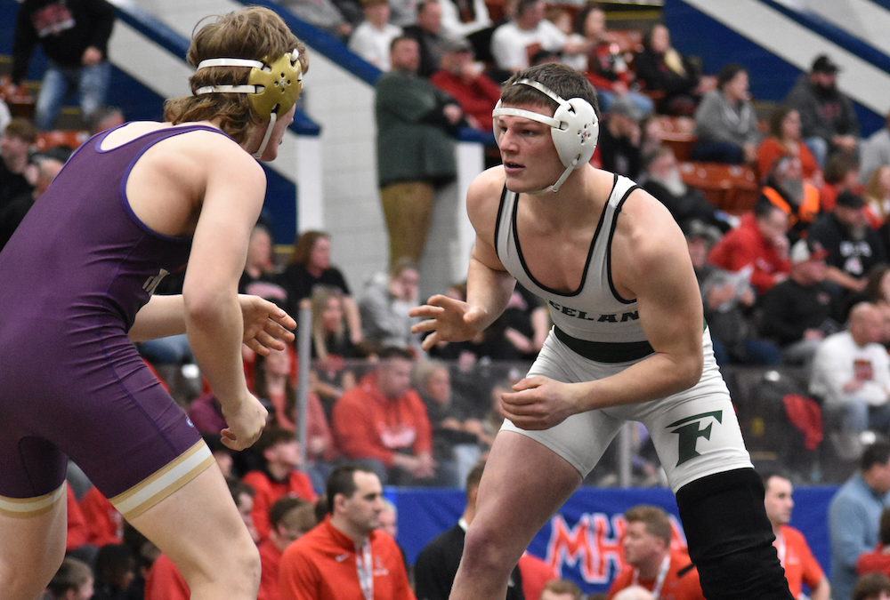 Freeland’s Brigham Smith, right, wrestles a Fowlerville opponent during last season’s Division 2 Quarterfinal.