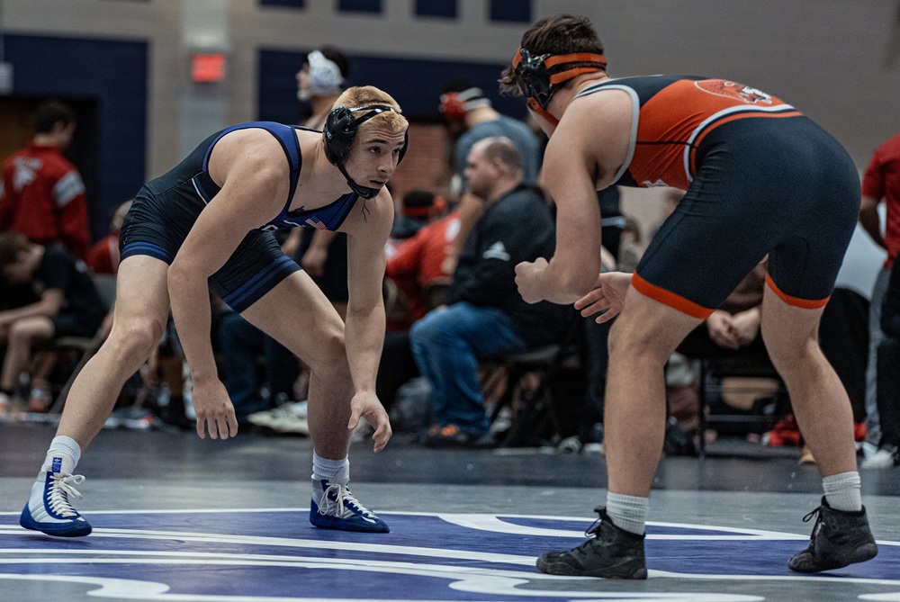Three Rivers' wrestler Louis Smith lines up opposite an opponent during a match.