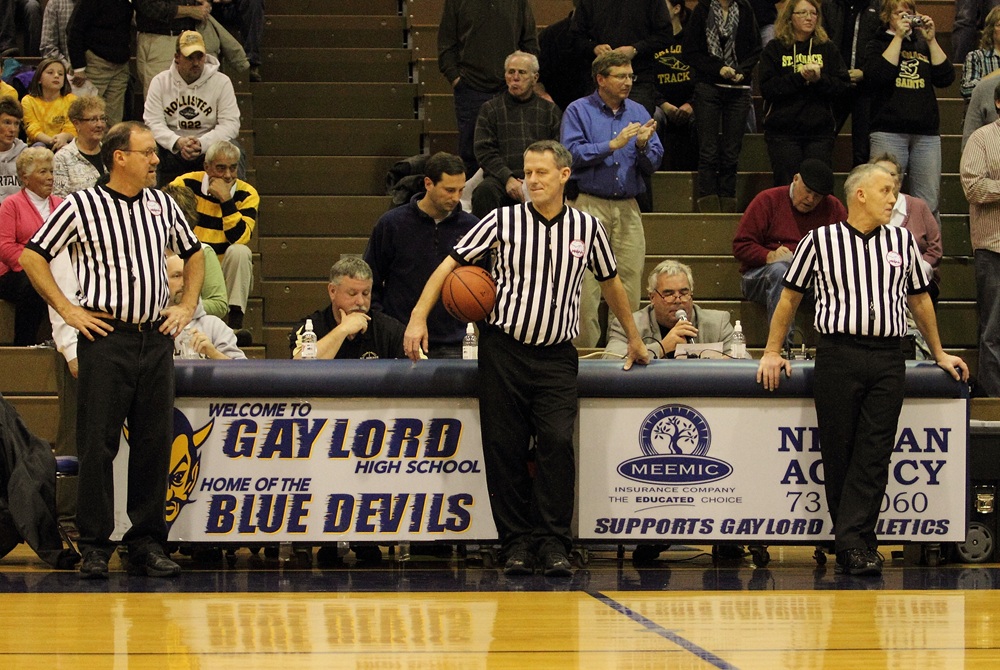 Brothers, from left, Steve, Dave and Tom Johnson – here at Gaylord High School – will referee the varsity boys basketball game Tuesday between Gaylord and Traverse City Central. 