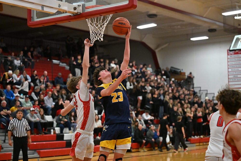Negaunee's Tristan Slater gets to the rim while defended by Marquette's Carter Fierstine during the Miners’ 56-52 win on Feb. 9. 
