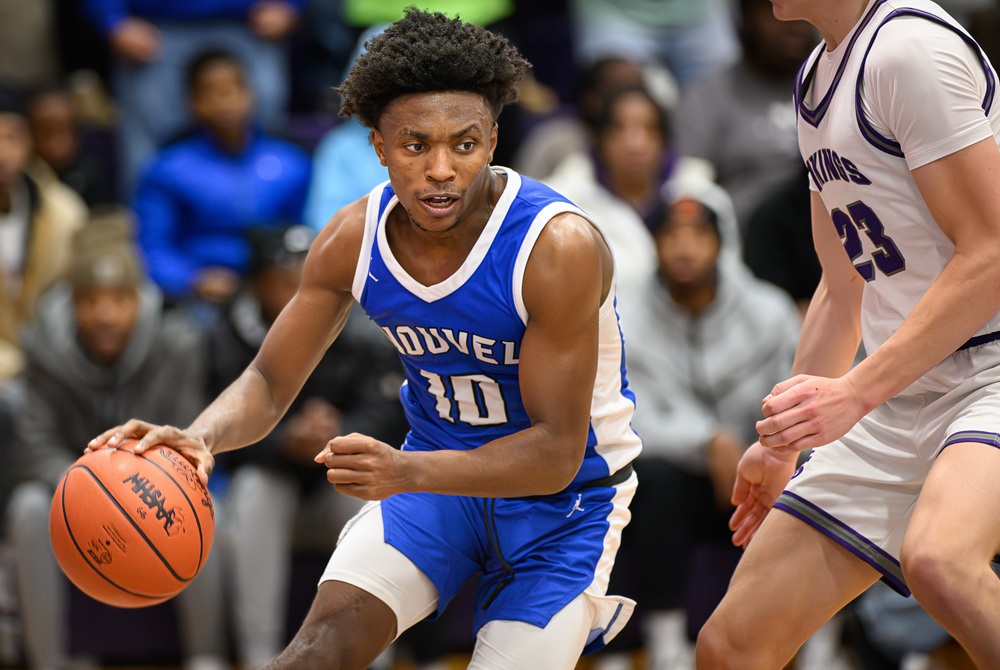 Saginaw Nouvel Catholic Central senior Rahmaan Kelley Jr. drives to the basket during the third quarter for two of his team-leading 20 points in the Panthers’ 44-35 victory over Saginaw Swan Valley on Dec. 17. 