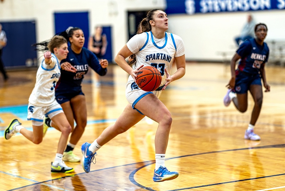 Livonia Stevenson’s Bella Sapia (23) drives into the lane during her team’s win over Berkley on Dec. 23.