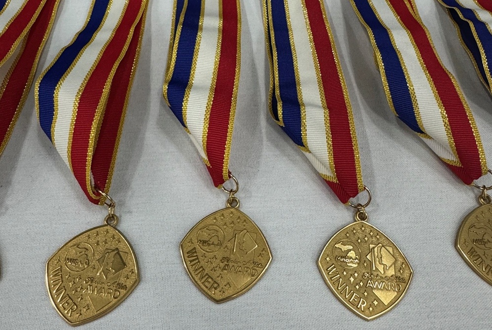 These are Scholar-Athlete medals laid out together on a table.