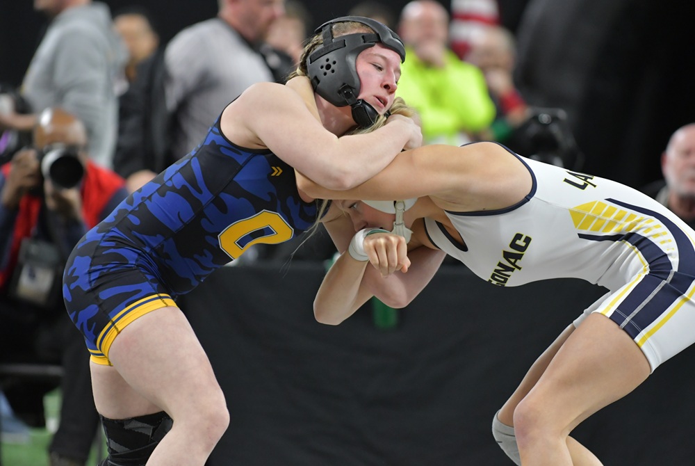 Oxford’s Cheyenne Frank, left, wrestles Algonac’s Sky Langewicz during last season’s Individual Finals at Ford Field. 