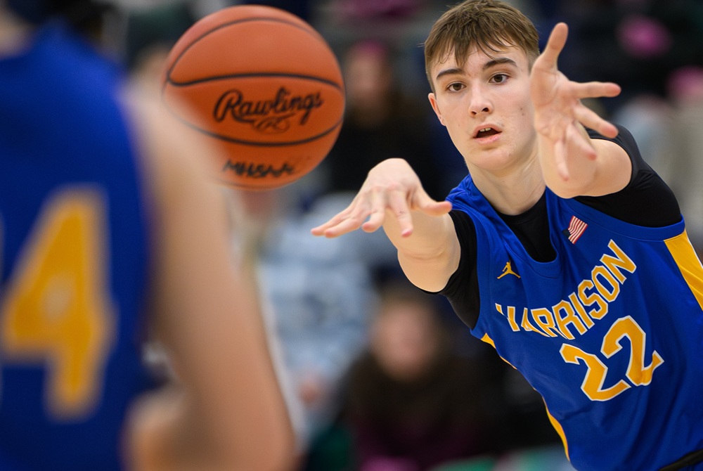Harrison junior Dennis Collin (22) makes an outlet pass during the second half of his team’s 48-24 win over Saginaw Arts & Sciences Academy on Jan. 12. 