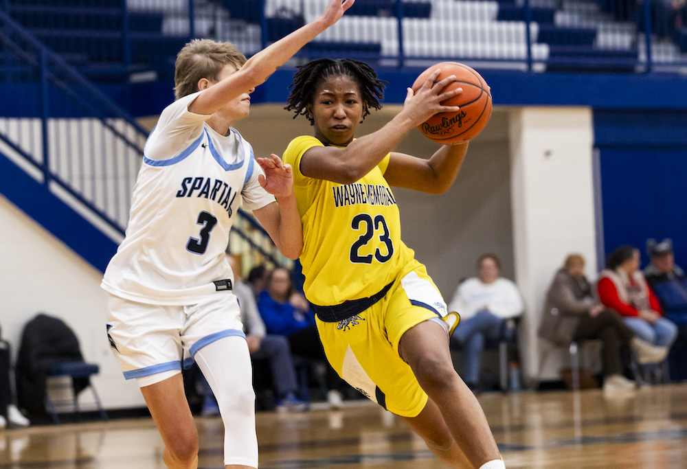 Wayne Memorial’s Micah Darling (23) drives into the lane during her team’s 55-40 win over Livonia Stevenson last week.