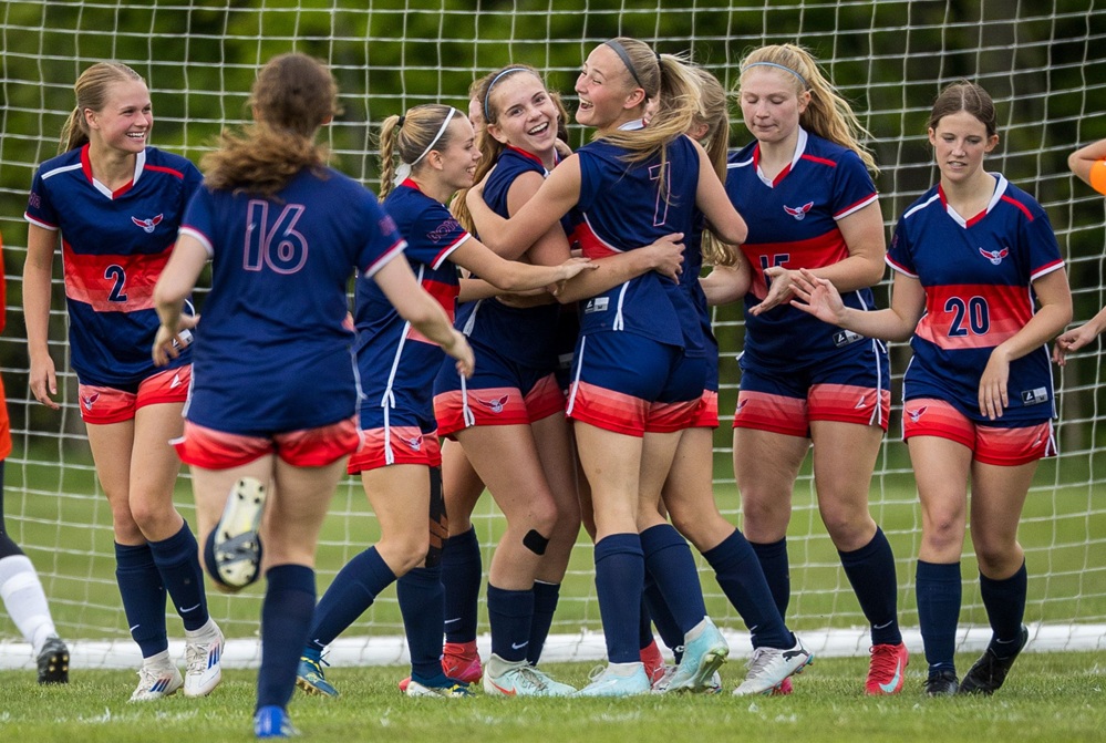 The Boyne City girls soccer team celebrates.
