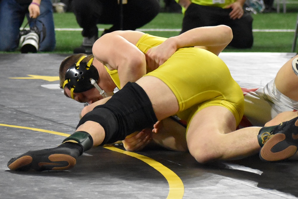 Otisville-LakeVille Memorial’s Fred Hammond (in yellow) works toward a win during last season’s MHSAA Individual Finals.