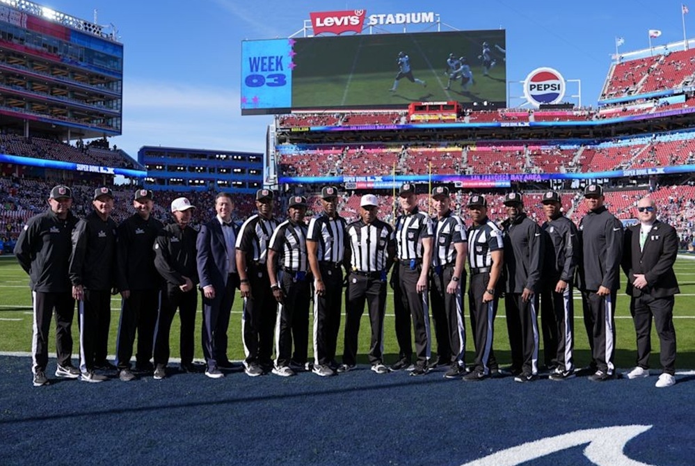 Shawn Smith, center with white hat, poses for a photo with his officiating crew at Sunday's Super Bowl.