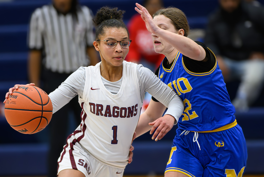 Saginaw Arts & Sciences Academy’s Symone Brandt (1) drives during a 51-43 loss to Mio on Friday. 