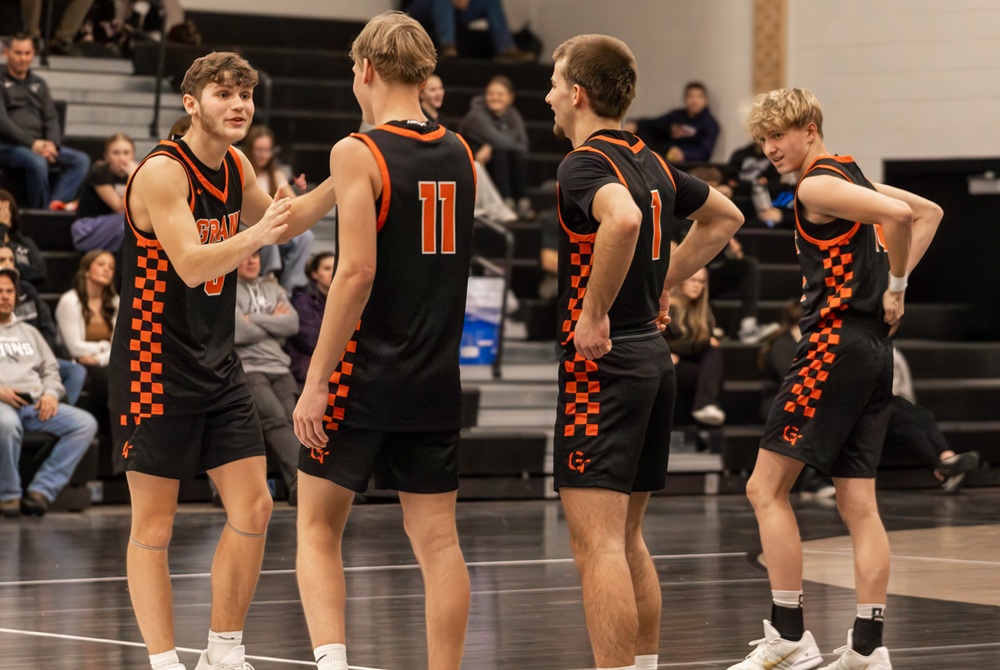 Grant’s Zaiden Phillips, far left, interacts with his teammates before a recent game. 