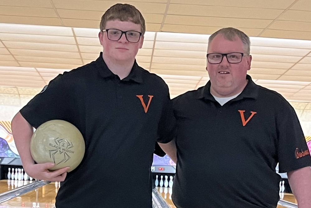 Vassar bowling coach Kevin Lindsley and son Zander pose for a photo during the program’s inaugural season. 