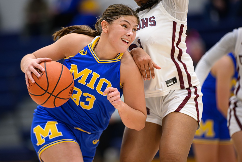 Mio’s Mia McGregor (33) handles the ball during a game against Saginaw Arts & Sciences earlier this month.
