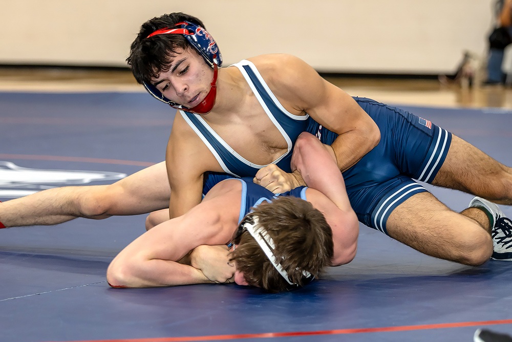 Livonia Stevenson and Franklin wrestlers compete during District competition.